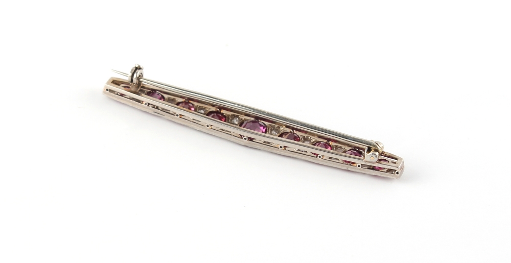 An Art Deco ruby & diamond long brooch, the nine oval cushion cut rubies weighing a total of - Image 3 of 3