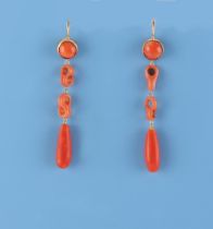 Ensuite with the preceding lot - a pair of yellow gold & carved coral link pendant earrings, with