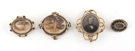 Property of a gentleman - a group of four 19th century mourning brooches, the second from smallest