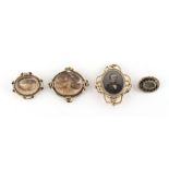 Property of a gentleman - a group of four 19th century mourning brooches, the second from smallest