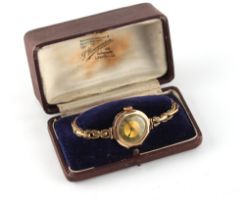 Property of a lady - a lady's 9ct gold octagonal cased wristwatch, 25mm across, on elasticated 9ct