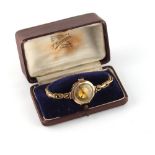 Property of a lady - a lady's 9ct gold octagonal cased wristwatch, 25mm across, on elasticated 9ct