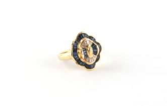 Property of a deceased estate - an 18ct yellow gold ring set with calibre cut diamonds &