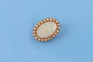 An unmarked high carat yellow gold opal & seed pearl oval brooch, 25mm long.