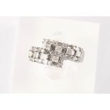 Property of a lady - an 18ct white gold diamond crossover ring, set with princess cut, baguette