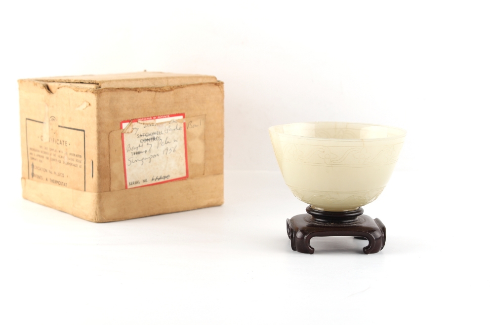 Property of a gentleman - a Chinese carved pale celadon or whitish jade footed bowl, 20th century,