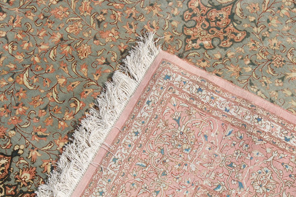 Property of a lady - a fine Persian Qum silk carpet, with pale pink ground, signed to one end in - Image 4 of 5