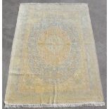 Property of a lady - a fine Persian Qum silk carpet, with pale blue ground, signed to one end
