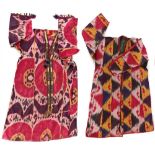 Property of a lady - two Uzbekistan or Afghanistan silk ikat robes or chapans, the larger with