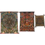 Property of a gentleman - three Tibetan thanka or thangka, all unframed, the largest 34.2 by 25.