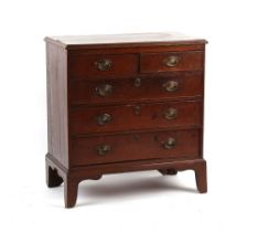 Property of a deceased estate - a George III oak chest of two short & three long graduated