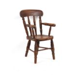 Property of a gentleman - a late Victorian child's Windsor armchair, with elm seat & turned legs.