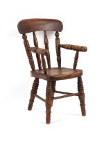 Property of a gentleman - a late Victorian child's Windsor armchair, with elm seat & turned legs.