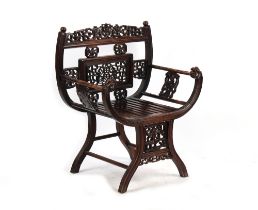 A late 19th century Chinese carved hongmu armchair, the arms carved in relief with prunus, with