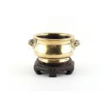 Property of a lady - a Chinese polished bronze censer, 18th century, with lion mask handles, 6-