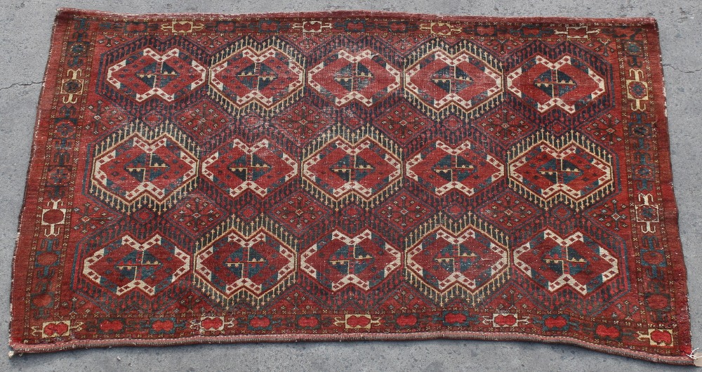 Property of a lady - a Turkoman juval or small rug, 70 by 42ins. (178 by 107cms.).