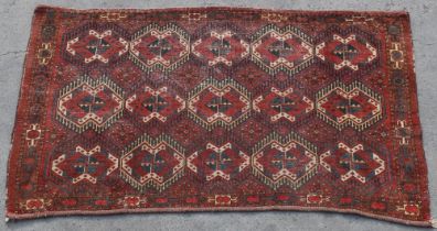 Property of a lady - a Turkoman juval or small rug, 70 by 42ins. (178 by 107cms.).