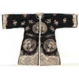 Property of a gentleman - a Chinese black silk jacket with embroidered couched silver threads