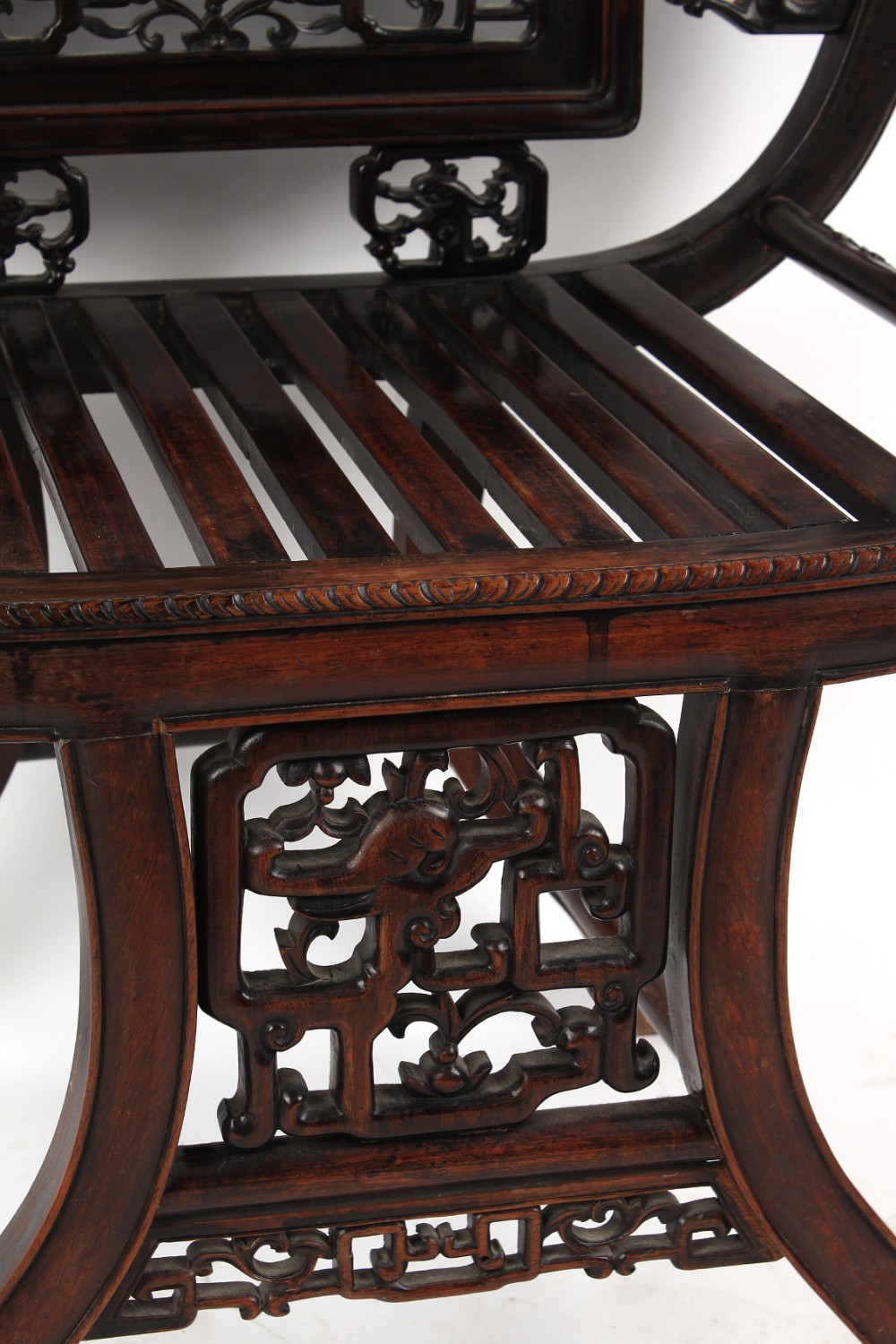 A late 19th century Chinese carved hongmu armchair, the arms carved in relief with prunus, with - Image 5 of 5