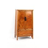 Property of a lady - a small Chinese softwood two-door cupboard, late 19th / early 20th century,
