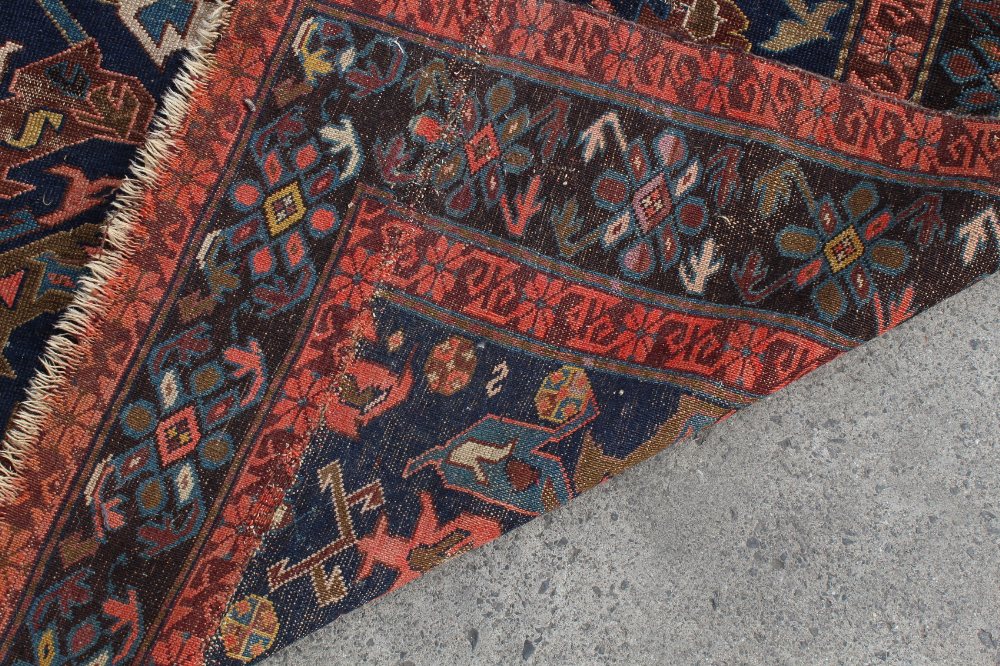 Property of a lady - a Caucasian rug, early 20th century, with navy ground, 77 by 55ins. (196 by - Image 2 of 2