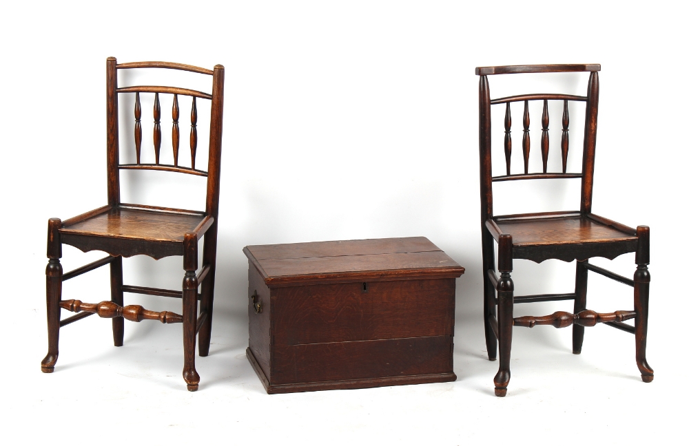 Property of a lady - two similar George III oak spindle-back country chairs; together with an 18th