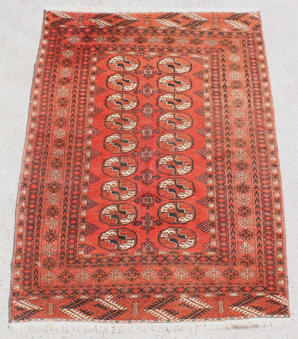 Property of a deceased estate - a Turkoman rug, with two rows of octagonal guls, 74 by 53ins. (188