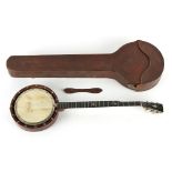Property of a deceased estate - a banjo, small chips to wood ring & 3 strings missing, in leather