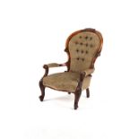 Property of a deceased estate - a Victorian carved walnut upholstered spoon-back armchair, with