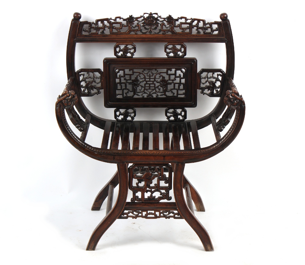 A late 19th century Chinese carved hongmu armchair, the arms carved in relief with prunus, with - Image 2 of 5