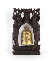 Property of a gentleman - an early 20th century Chinese bronze bell on carved hardwood & silver wire