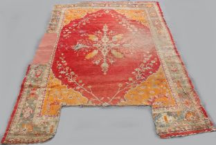 Property of a lady of title - an antique Turkish Ushak or Oushak carpet, two sections missing, other