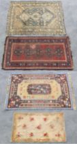 Property of a lady - four assorted rugs including a kelim, 88 by 61ins. (234 by 155cms.) (4).