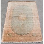 Property of a lady - a fine Persian Qum silk carpet, with pale pink ground, signed to one end in