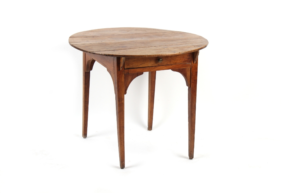 Property of a lady - a late 19th century French fruitwood circular topped table, with frieze drawer,