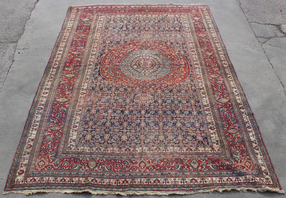 Property of a lady - a large antique Persian Khorassan carpet, 193 by 133ins. (490 by 338cms.).