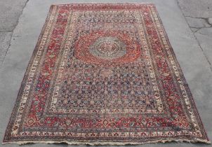 Property of a lady - a large antique Persian Khorassan carpet, 193 by 133ins. (490 by 338cms.).