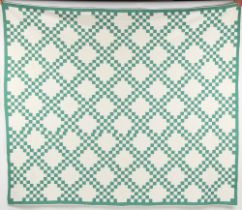 Property of a lady - a large green & white geometric patchwork quilt, probably late 19th century, in