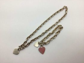 A Modern Toggle Style Bracelet, of chain link, suspending heart shape pendants, stamped "925", a
