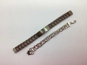 A Hallmarked Silver Modernist Panel Style Identity Bracelet, of brutalist textured design,