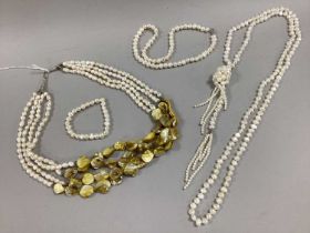 A Modern Fresh Water Pearl Four Row Necklace, together with a long fresh water pearl bead necklace