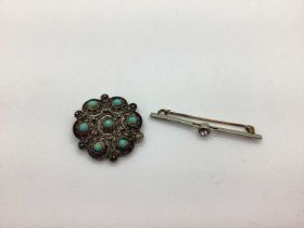 A Stone Set Filigree Brooch of Floral Design, stamped "Silver 925", together with a bar brooch. (2)