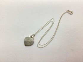 Tiffany & Co; A Monogram 'M' Pendant, on a hallmarked silver fine belcher link Tiffany & Co chain (