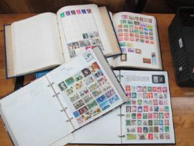 Stamps; A collection of world stamps, mainly modern, housed in four loose leaf albums, plus one