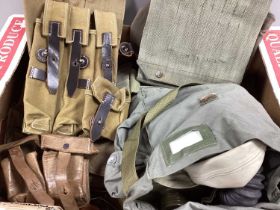 Items of Military equipment comprising respirator, canvas and leather webbing from various eras