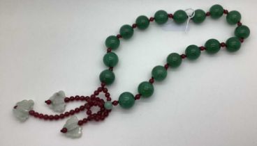 A Modern Polished Green Hardstone Chunky Bead Necklace, with red bead spacers with butterfly drops.