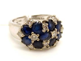 A Modern Sapphire and Diamond Set Dress Ring, of bombé style, claw set to the front with oval cut