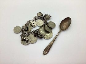 A Vintage Curb Link Charm Bracelet, suspending GB and Foreign assorted coins, charm pendants, etc;