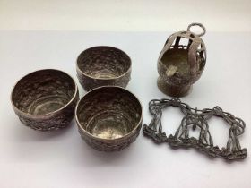 A Set of Three Small Middle Eastern Bowls, each allover foliate detailed in relief, approximately