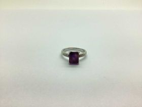 A Modern Amethyst and Diamond Dress Ring, rectangular claw set to the centre, high between diamond